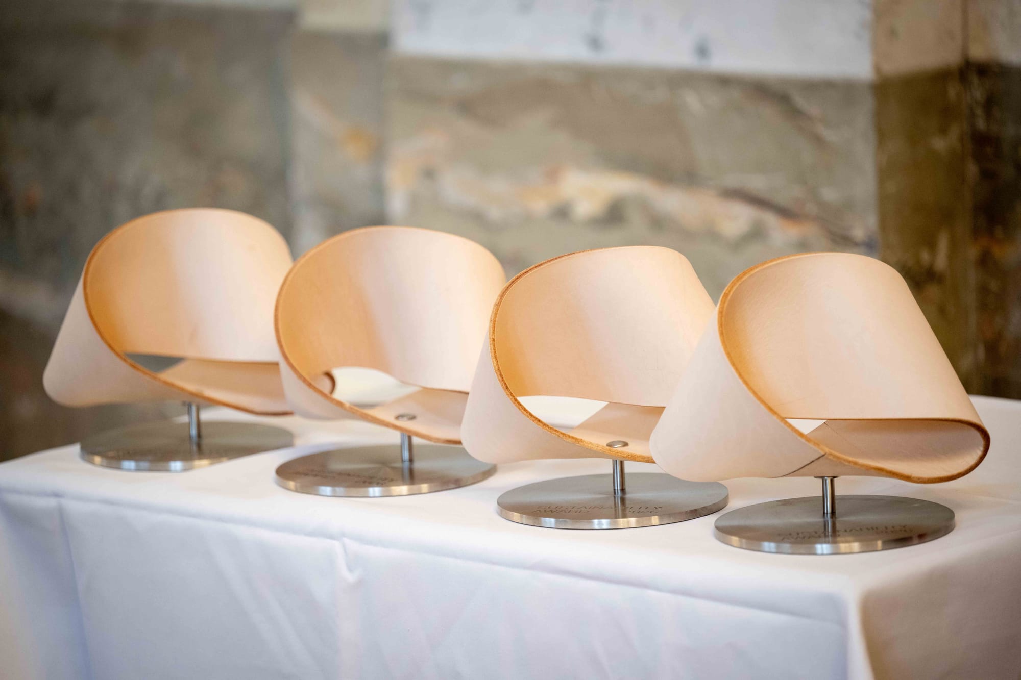 Die vier Gold-Trophäen des Sustainability Award 2026